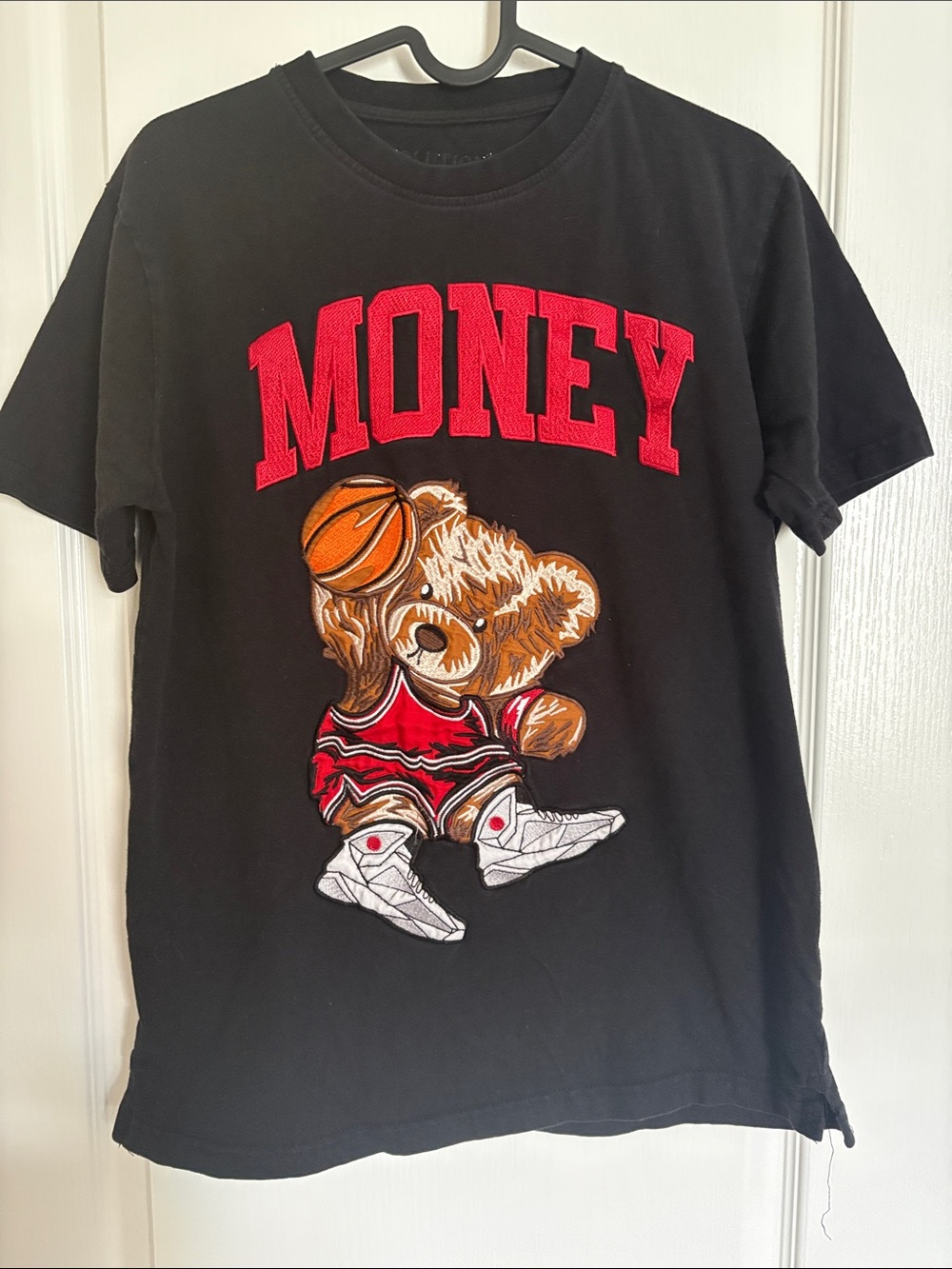Evolution In Design Black Embroidered Teddy Bear Money Basketball Graphic Tee